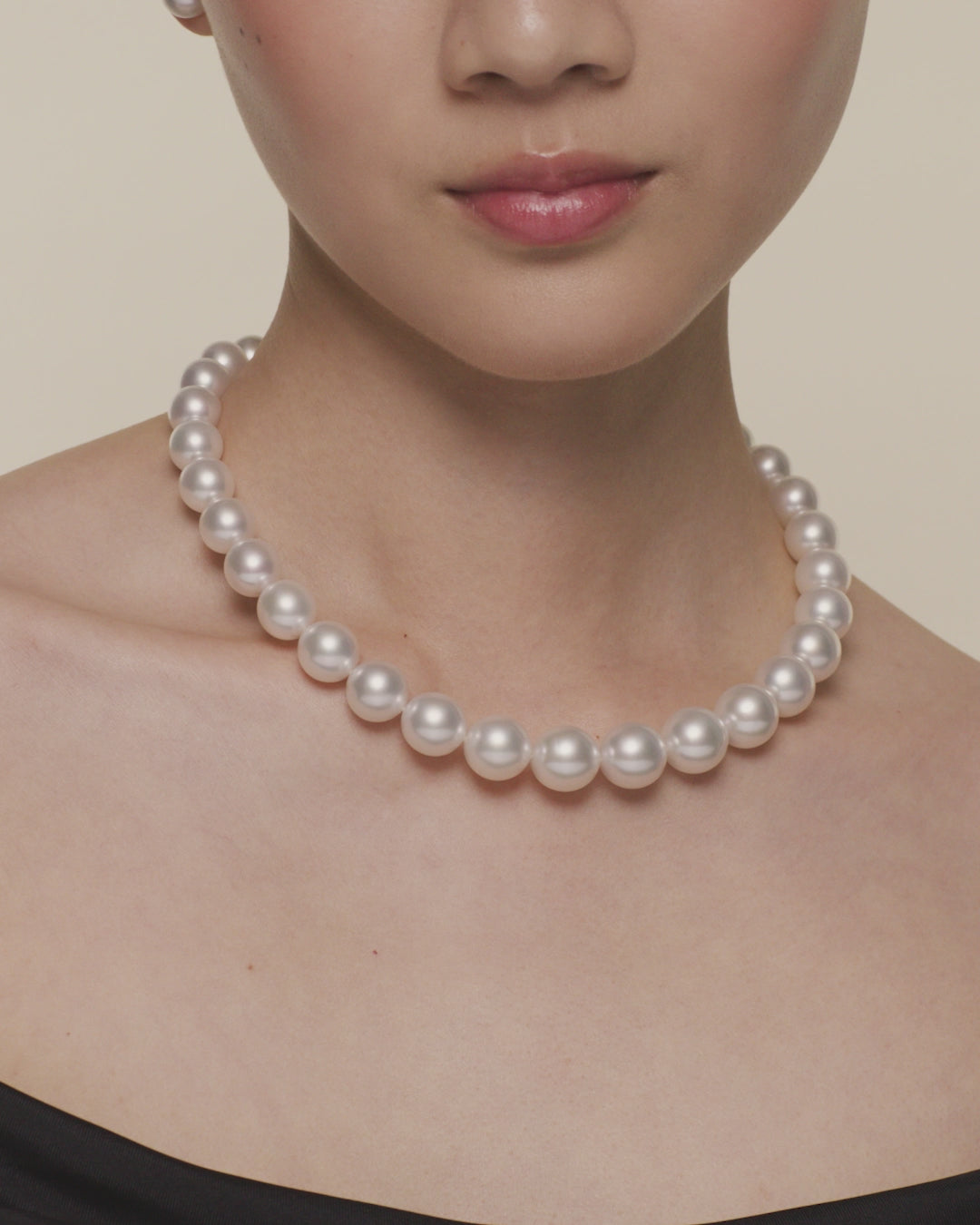 Paspaley round pearl choker strand necklace featuring 14–15mm round pearls and diamond strands, luxury South Sea pearl jewellery.