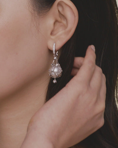 Paspaley-Diamond-Lavalier-Pearl-Earrings-On-Body-DH14E21wPB12-SKU-H14E21W-H14Q02PB12