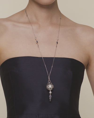 Blue sapphire hero lavalier pearl necklace featuring a 15mm round South Sea pearl, blue sapphires and white gold